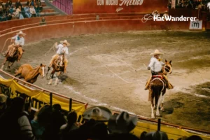 A couple of cowboys displaying their roping skills by roping a horse