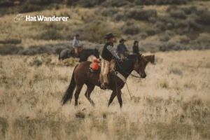 A team of cowboys patrolling their ranch boundary