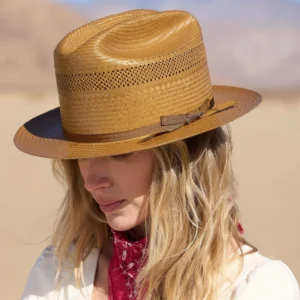 A girl wearing Open Road Vented Straw Cowboy Hat